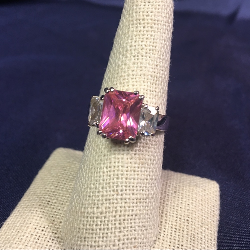 Pink emerald cut three stone ring